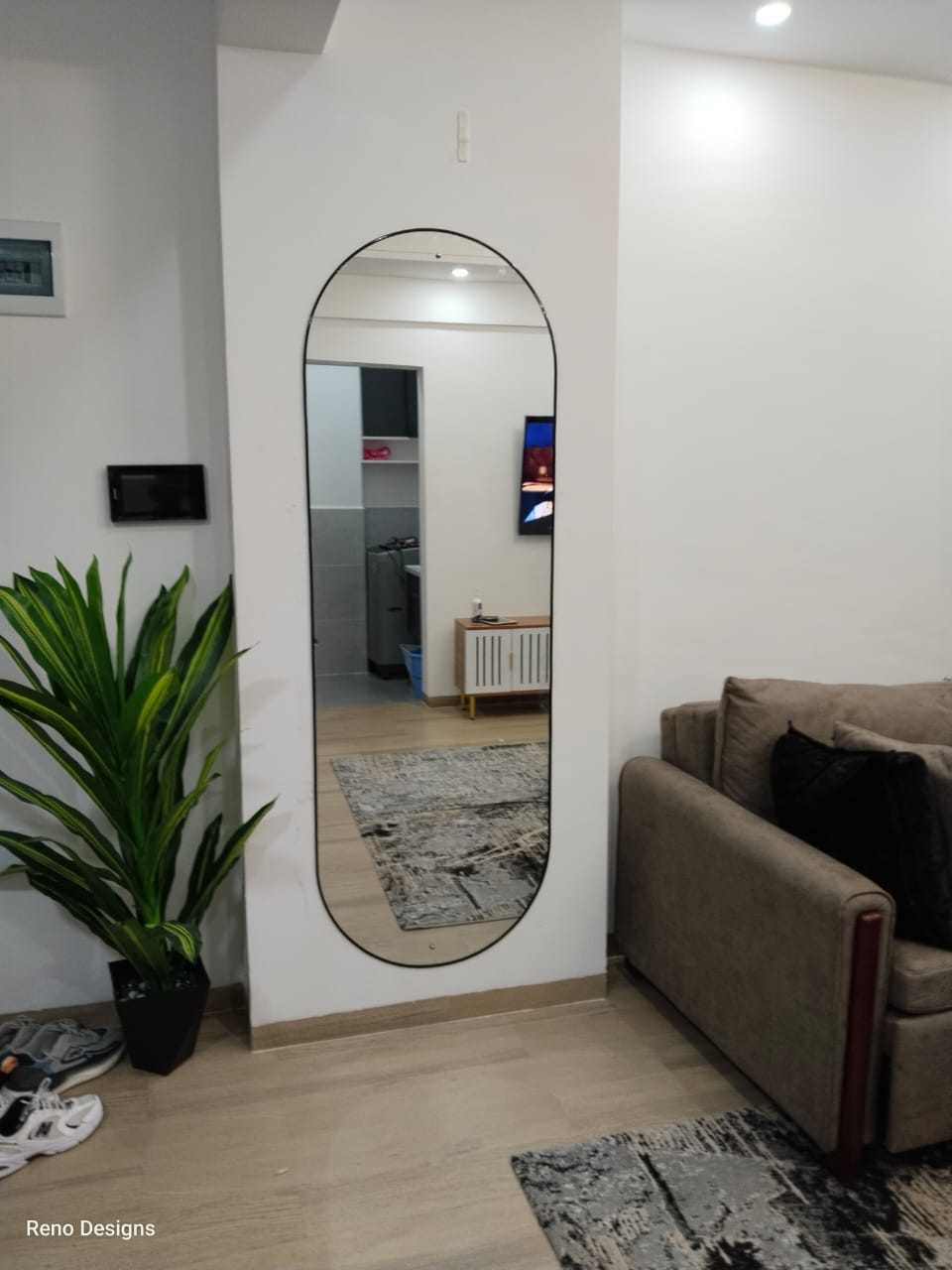 Reno full-length arched mirror in a living room